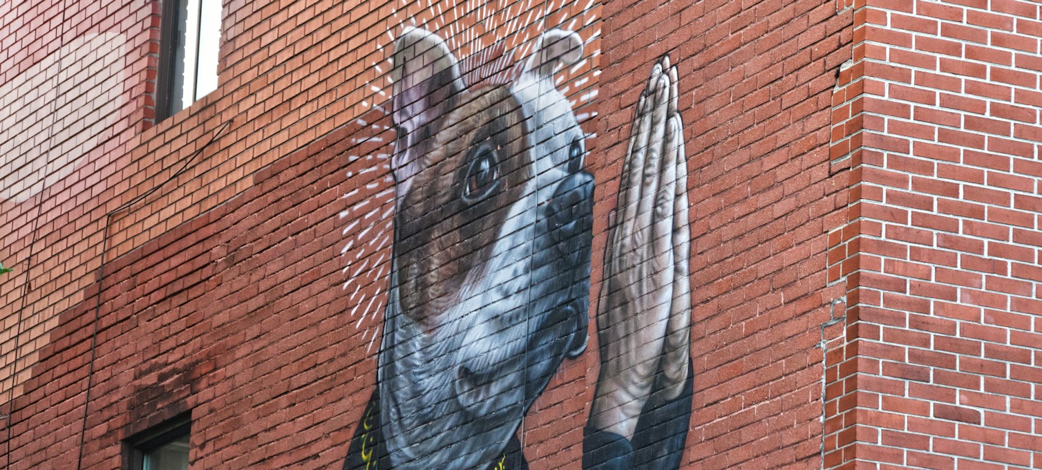 Mural on a brick facade on Boulevard Saint-Laurent in Montreal