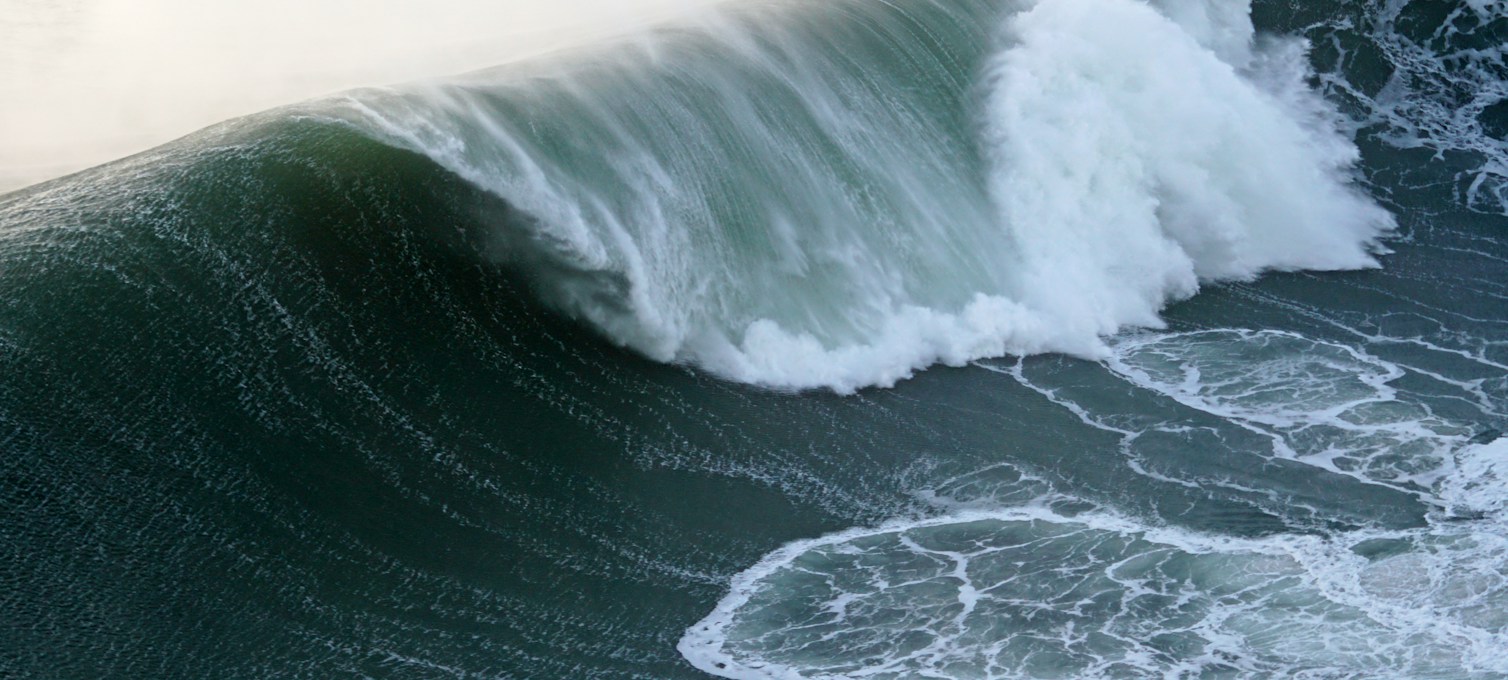 Large Atlantic waves breaking on the beach at Nazaré, Portugal