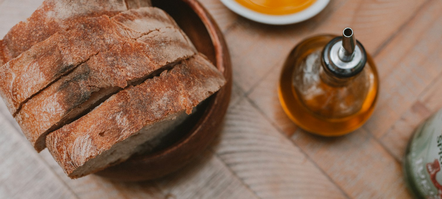 Bread and olive oil on a wooden table