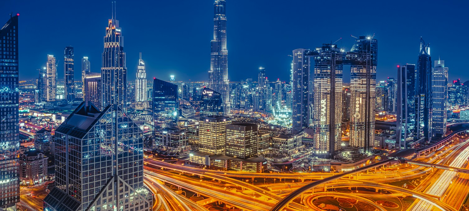 Dubai skyscrapers lit up at night