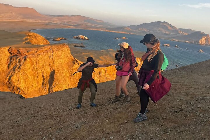 Walkers on a desert trail in the Paracas National Reserve