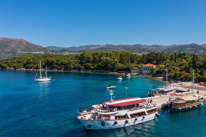 Large white boat moored in a harbour