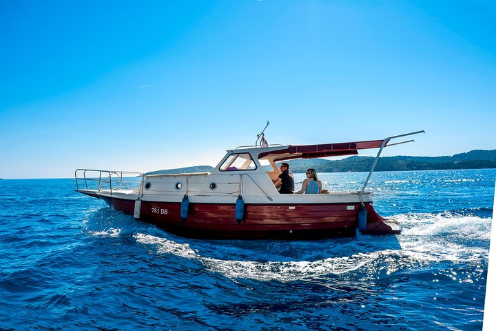 Private boat with a terrace in a cove