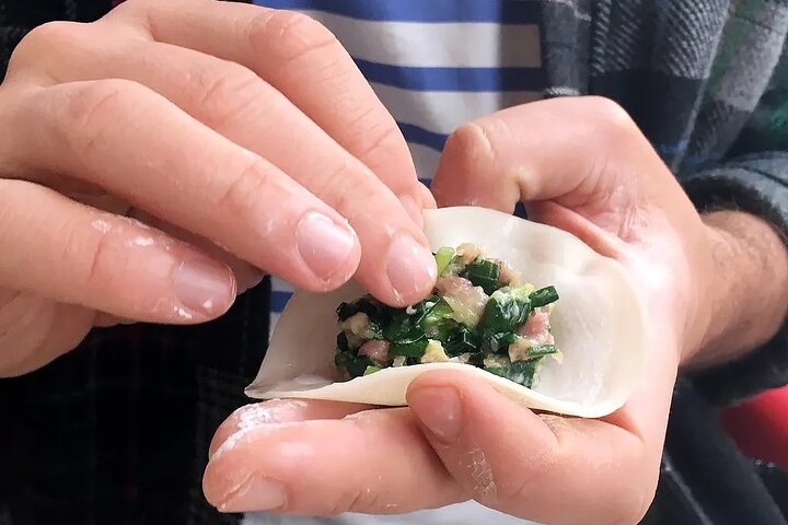 Hand-made Chinese dumplings on a work surface