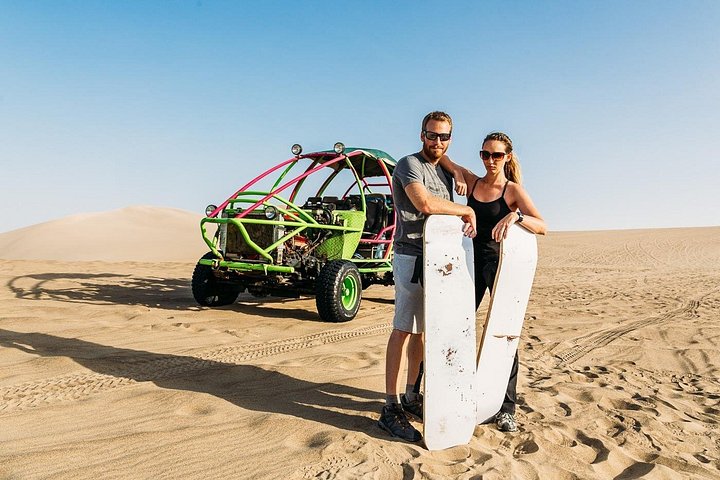 Dune buggy on the sand above the Huacachina oasis