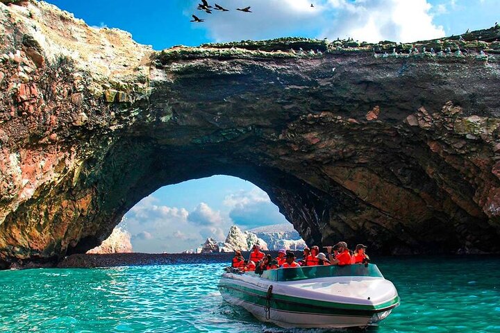 Tour boat near the rocky islands off Paracas, Peru