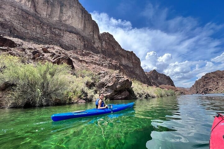Kayakers paddling the Colorado River through Black Canyon toward Emerald Cave