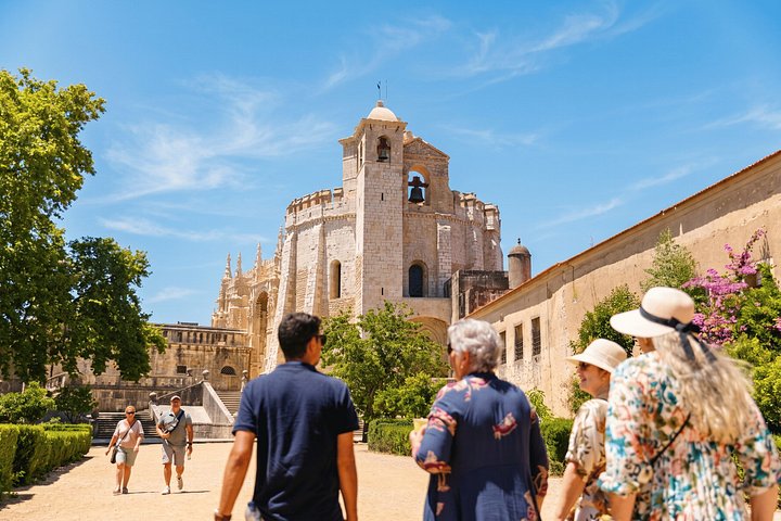 Visitors walking toward the Convent of Christ church in Tomar