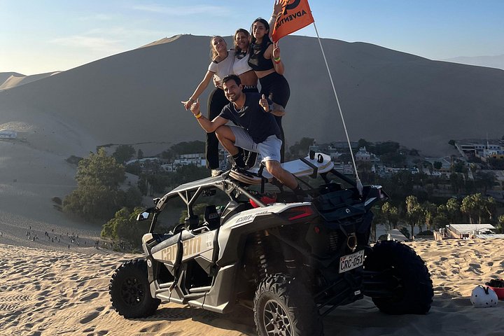 Side-by-side UTV crossing the Huacachina dunes
