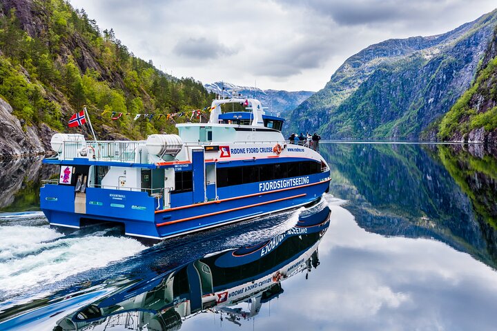 Rødne Fjord cruise ship on a fjord with steep cliffs