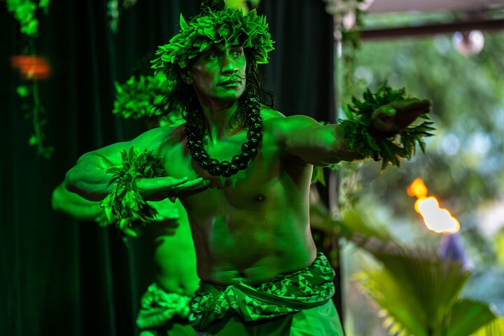 Outdoor Polynesian celebration with dancers and torches