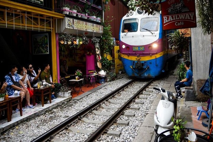 Narrow Hanoi street with a train on Train Street