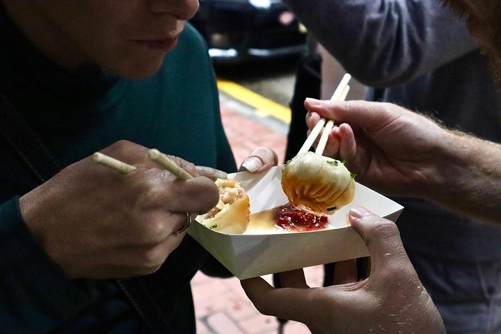 Dim sum plates served on a restaurant table