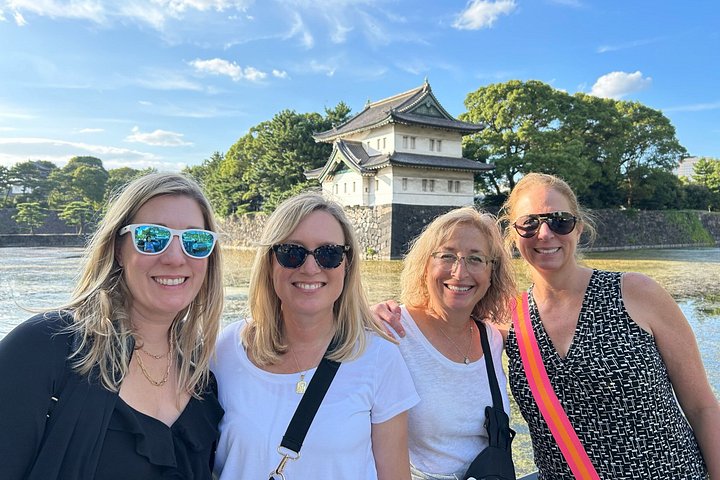 Private guide and visitors walking through a Tokyo neighborhood