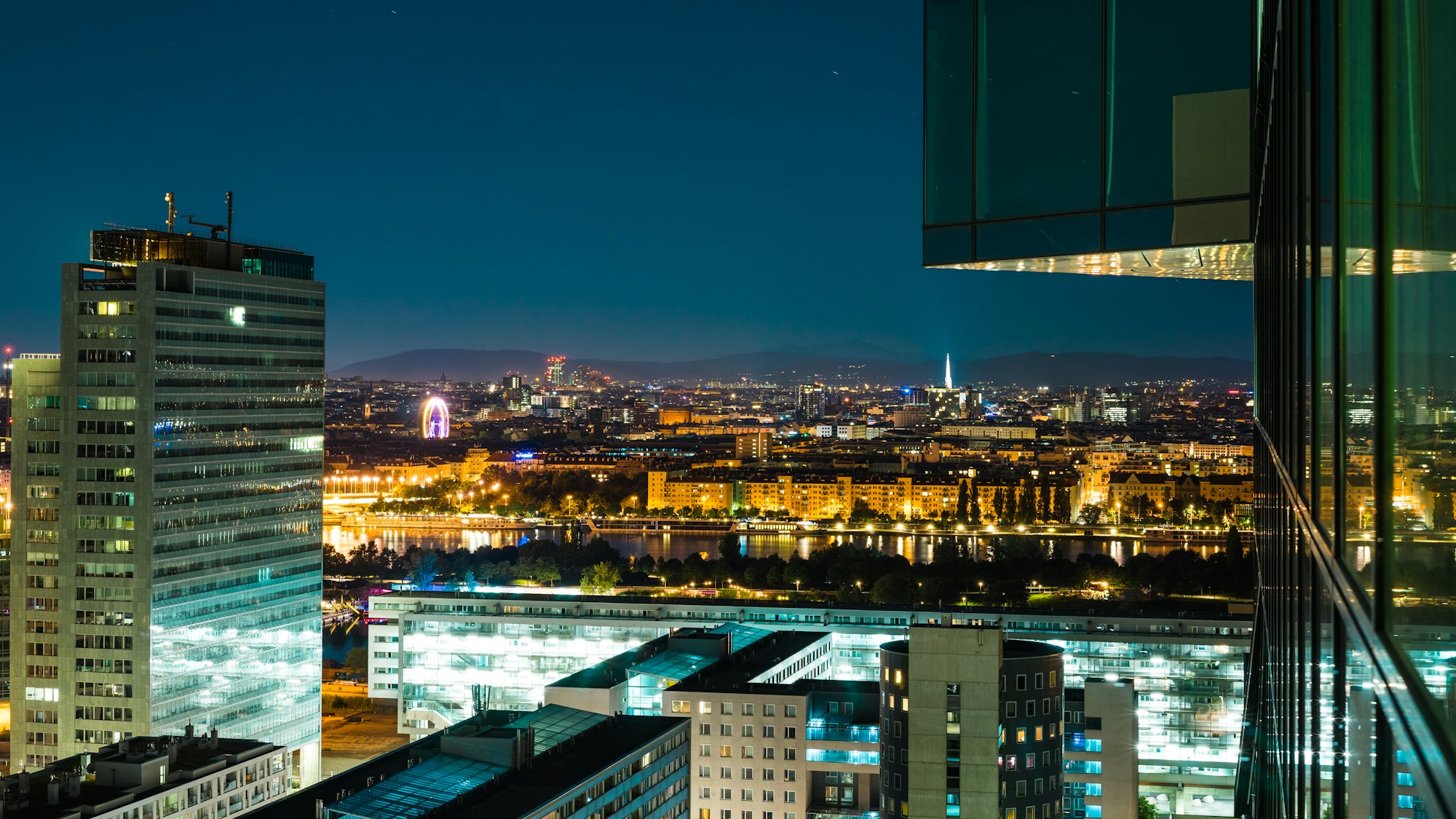 Vienna lit up at night, view over the city and its landmarks