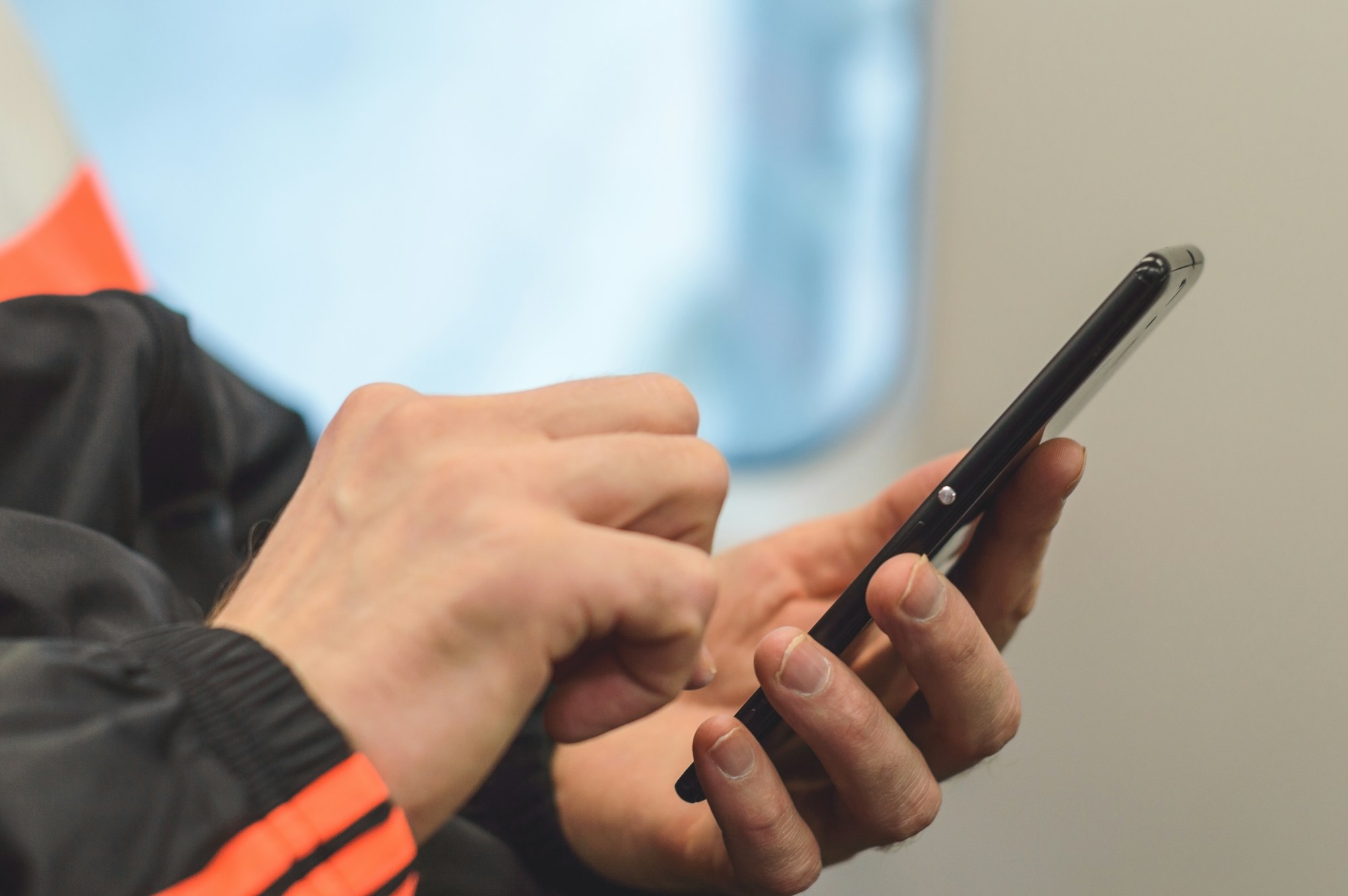 Flight tickets and a smartphone for comparing fares