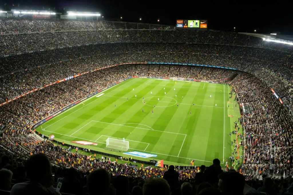 Supporters dans un stade de football — ambiance Coupe du Monde 2026